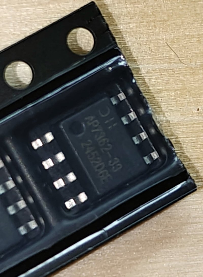A new AP7362-33 voltage regulator, eight pins, still sealed in its cut tape
