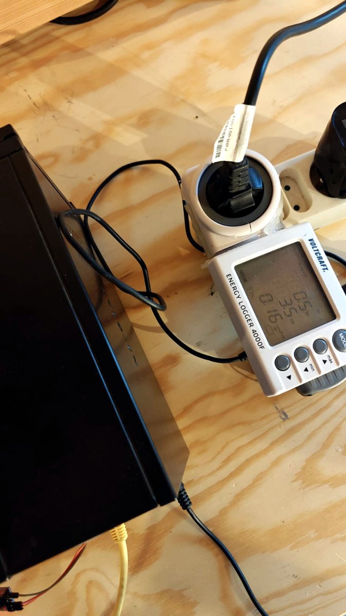 The RN102 switched off on the desk, next to the Voltcraft plug meter