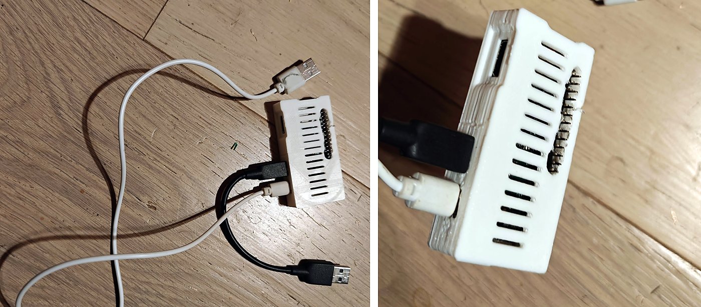 The Raspberry Pi Zero W in a white 3D-printed case, with two micro-USB cables: one for power, one for data to the car